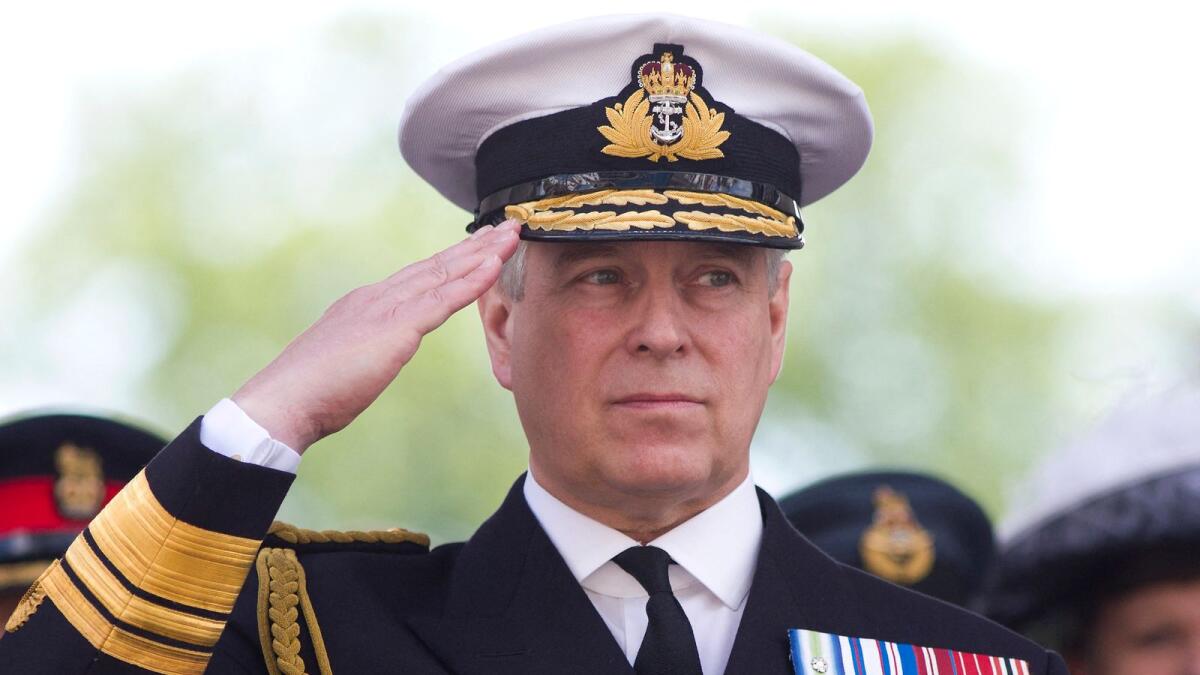 File: Britain's Prince Andrew, Duke of York salutes military personnel during the Armed Forces day parade in Guildford on June 27, 2015. (Photo: AFP)