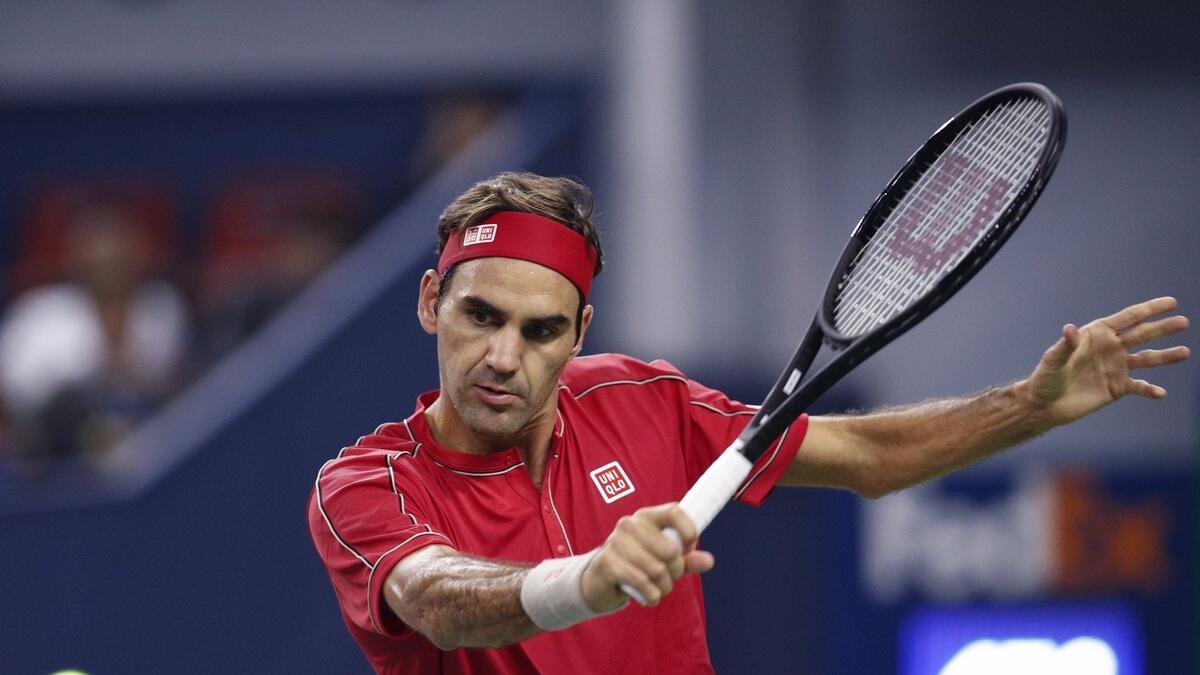 Federer wins Shanghai Masters opener; Murray loses
