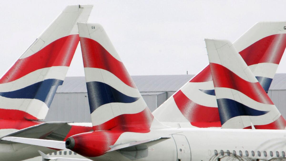 FILE PHOTO: British Airways aircraft are seen stationary on the tarmac of London's Heathrow Airport in west London, August 12, 2005.