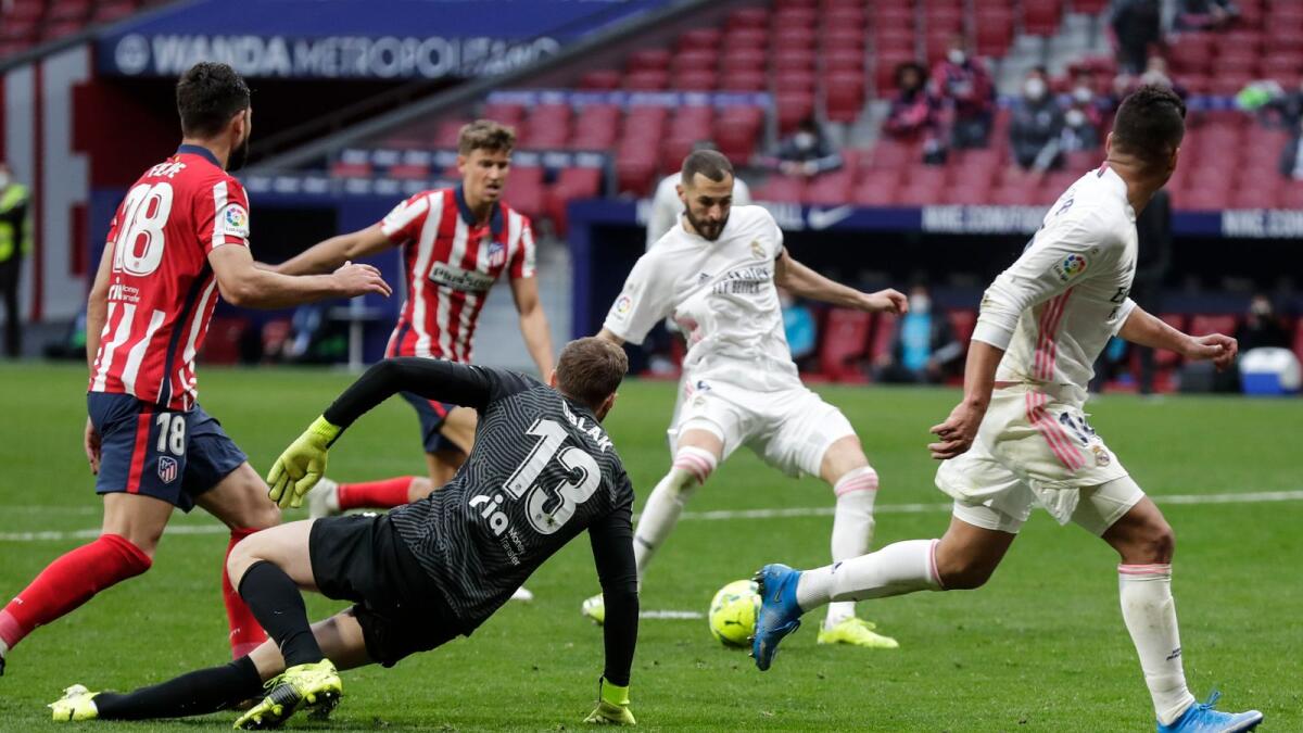 Real Madrid’s Karim Benzema scores a goal against Atletico Madrid. — AP