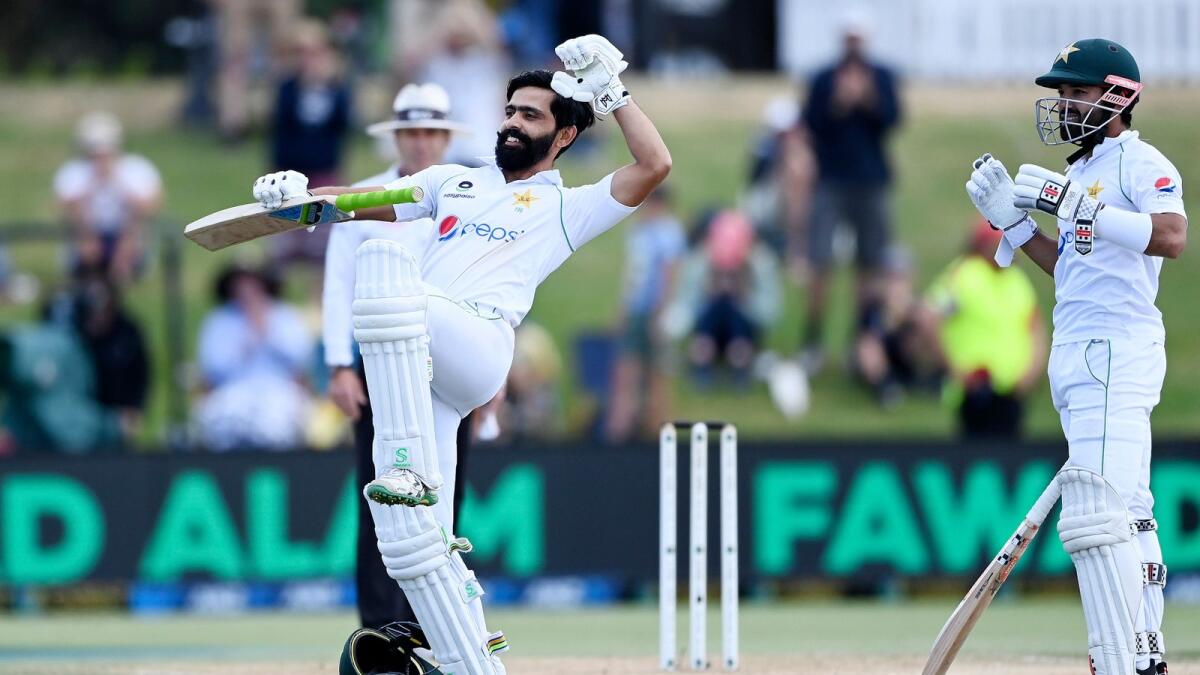 Pakistan’s Fawad Alam (left) celebrates his century on the final day of the first Test against New Zealand. (AP)
