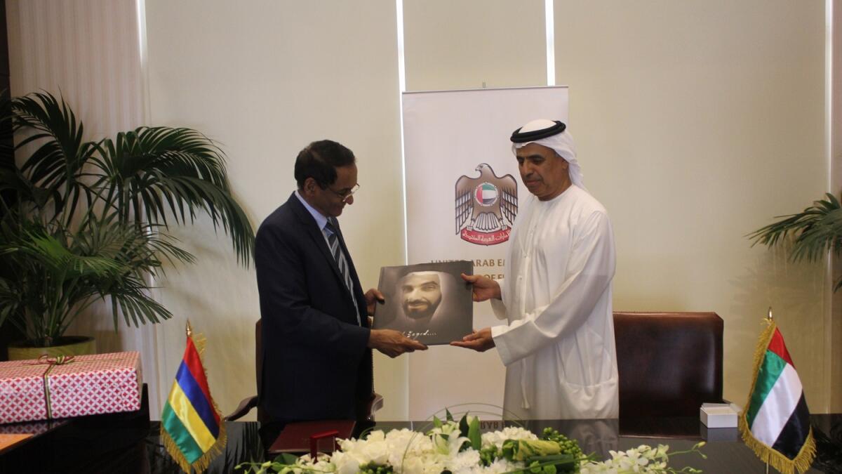 Obaid Humaid Al Tayer and Vishnu Lutchmeenaraidoo sign an agreement on encouragement and protection of investments between the UAE and the Republic of Mauritius. — Supplied photo