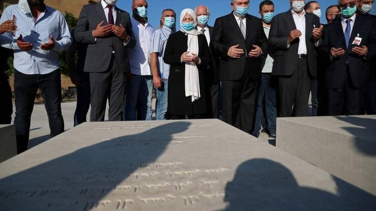 Bahiya Hariri, sister of Lebanon's former Prime Minister Rafik Hariri, prays at his grave after UN-backed tribunal convicted a Hezbollah member of conspiracy to kill Hariri in a 2005 bombing, in Beirut, Lebanon.