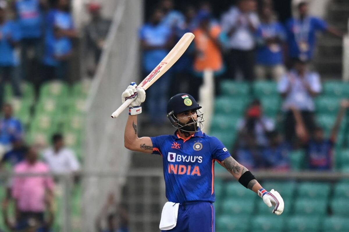 India's Virat Kohli celebrates after scoring a century. — AFP