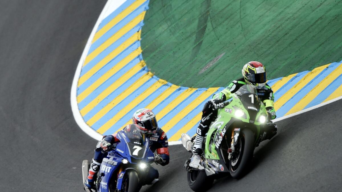 Kawasaki ZX10R Formula EWC French rider Erwan Nigon (L) and Yamaha YZF-R1 formula EWC Italian rider Niccolo Canepa, compete during the second free practice session of the 43nd Le Mans 24-hours endurance moto race at Le Mans, north-western France. Photo: AFP