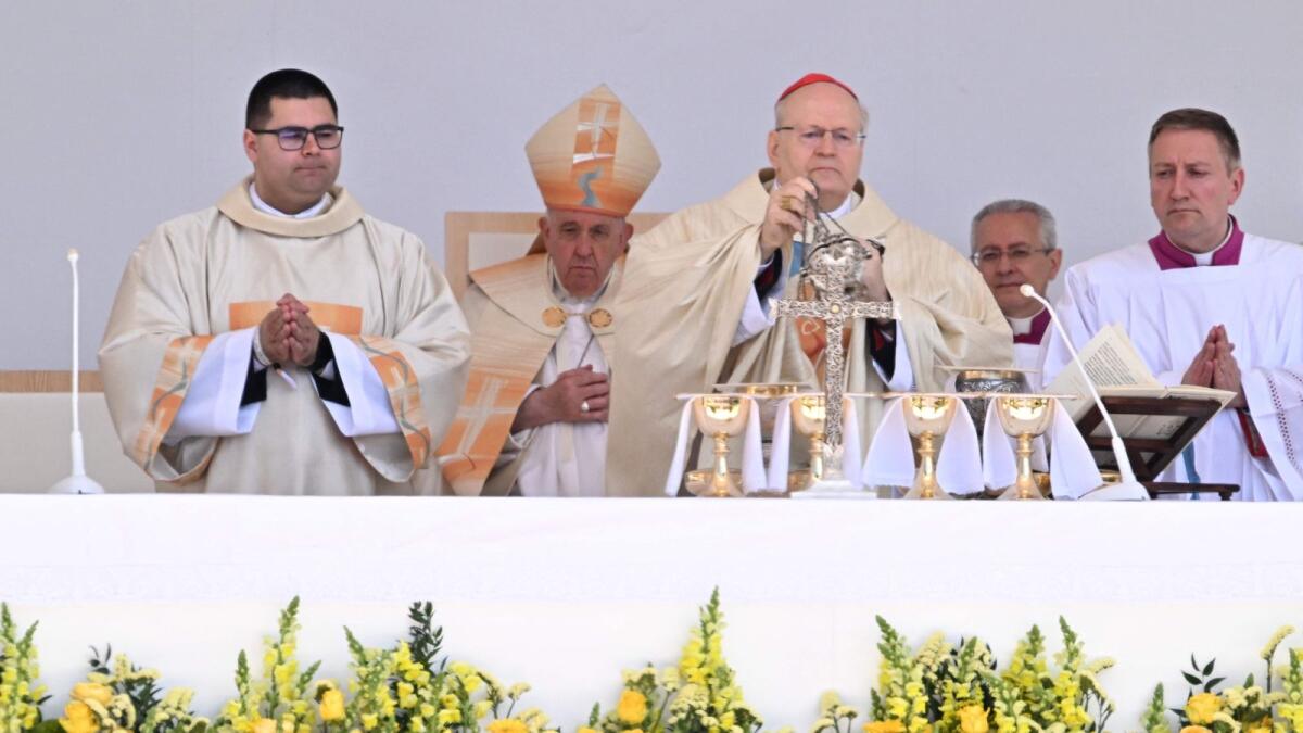 Pope Francis (2nd L) and Cardinal Peter Erdo (3rd L), Archbishop of Esztergom-Budapest and Primate of Hungary, celebrate a holy mass at Kossuth Lajos' Square during the Pope's visit in Budapest on April 30, 2023, the last day of his tree-day trip to Hungary.  — AFP