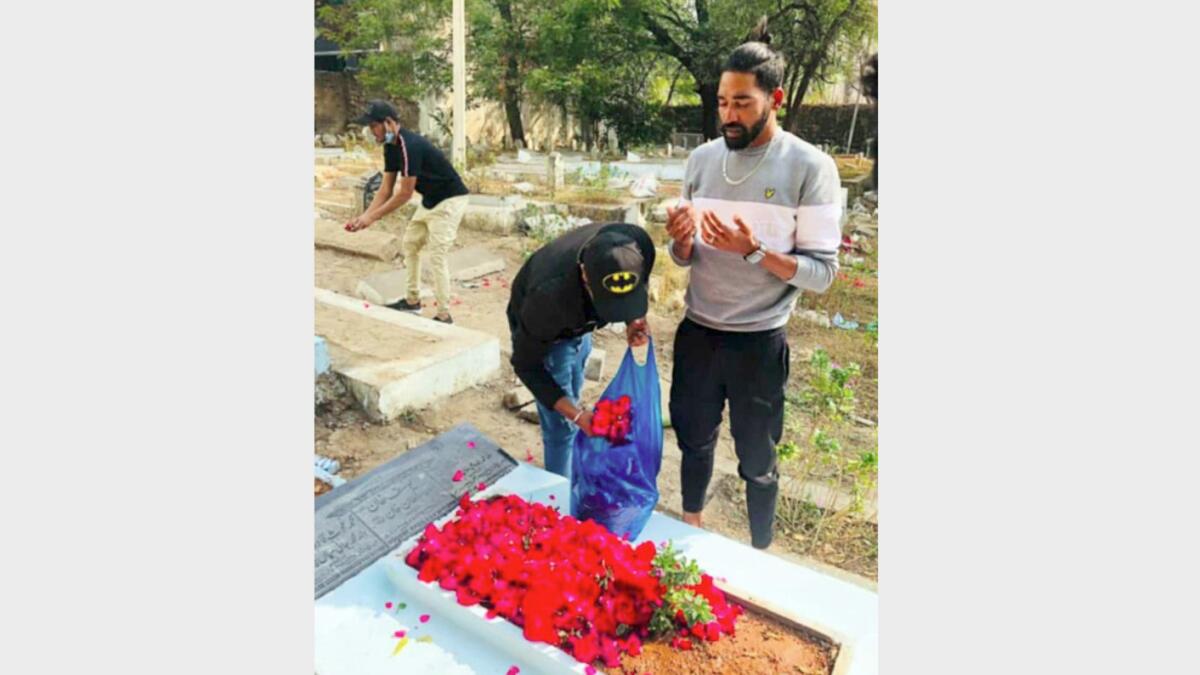 Mohammed Siraj paying tribute to his late father at a graveyard in Hyderabad on Thursday. (ANI)