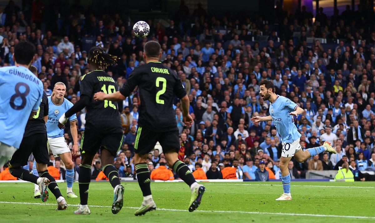 Manchester City's Bernardo Silva scores their second goal. — Reuters