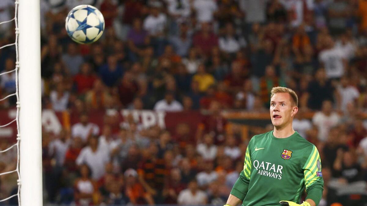 Barcelona goalkeeper Marc-Andre ter Stegen looks in disbelief as AS Roma’s Alessandro Florenzi (not in picture) sends a long-range shot to the back of the net.