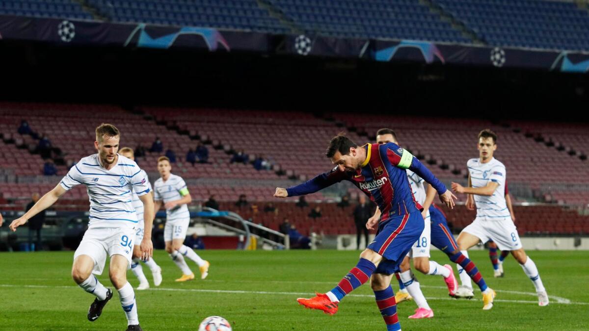 Lionel Messi, who scored a penalty for Barcelona, shoots at goal.