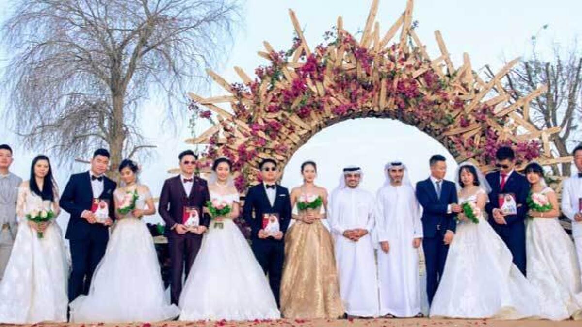 The wedding of nine Chinese couples was an exclusive, private event. — Supplied photo