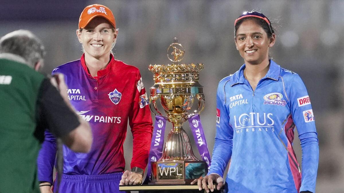 Mumbai Indians captain Harmanpreet Kaur, says she went to every class in school asking girls if they can play cricket, with and Delhi Capitals captain Meg Lanning before a 2023 Women's Premier League (WPL) Twenty20 cricket final match. — PTI