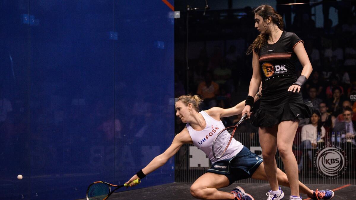 Laura Massaro of England (left) reaches for the ball against Nour El Sherbini of Egypt during their final match of the PSA Womens World Championships in Kuala Lumpur on April 30, 2016. 