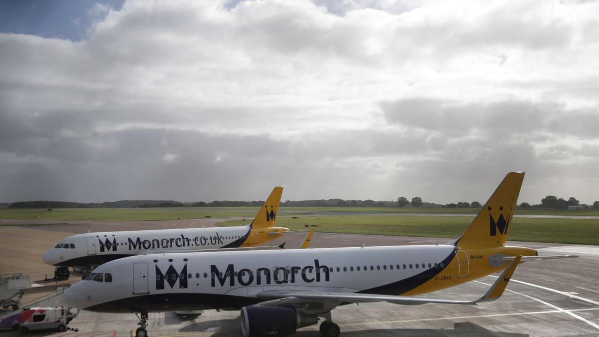 FILE. Grounded Monarch airplanes sit on the tarmac at Luton airport, south England on October 2, 2017. Photo: AFP