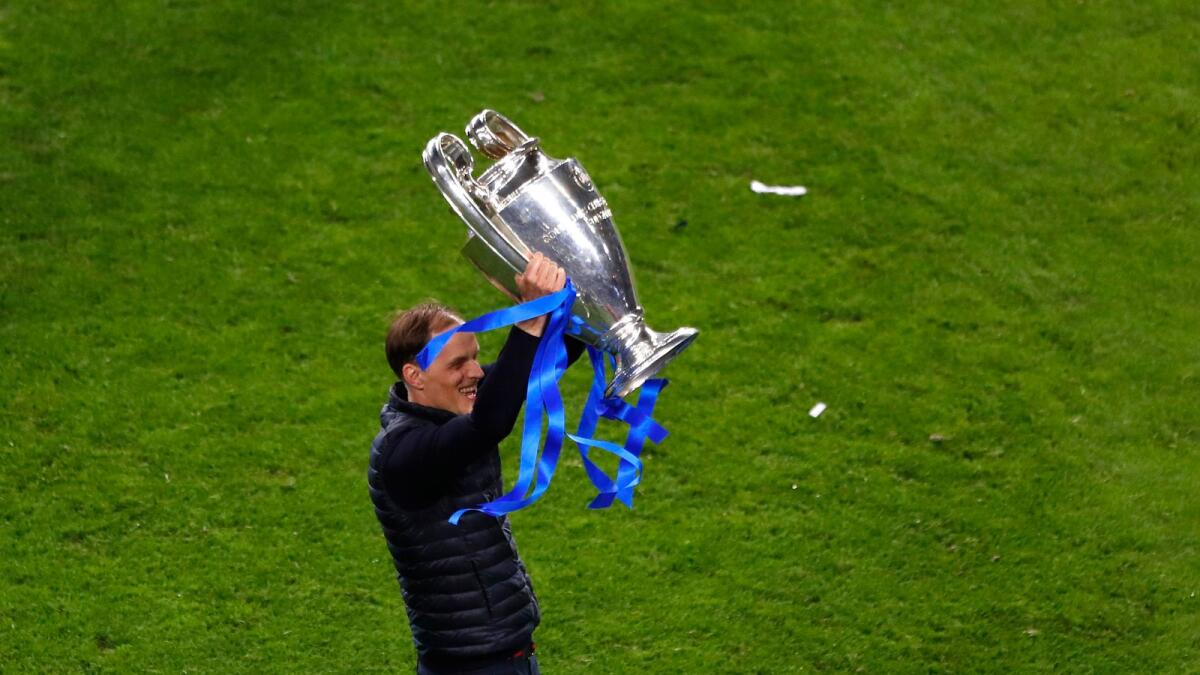 Thomas Tuchel celebrates with the trophy after winning the Champions League final against Manchester City. — AP
