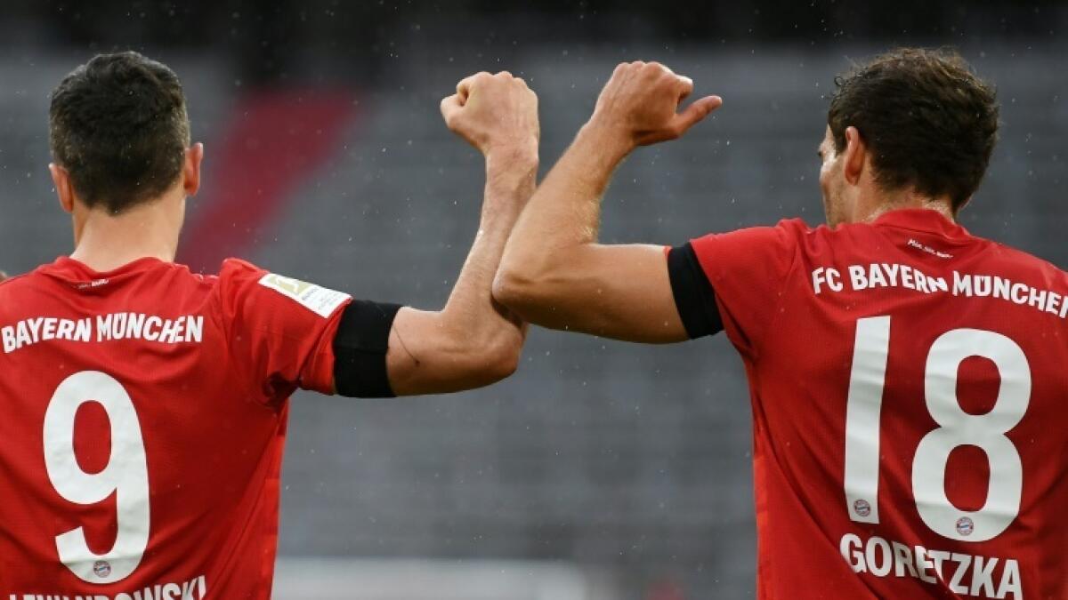 Leon Goretzka (right) celebrates scoring the opening goal with Bayern Munich striker Robert Lewandowski. - AFP file