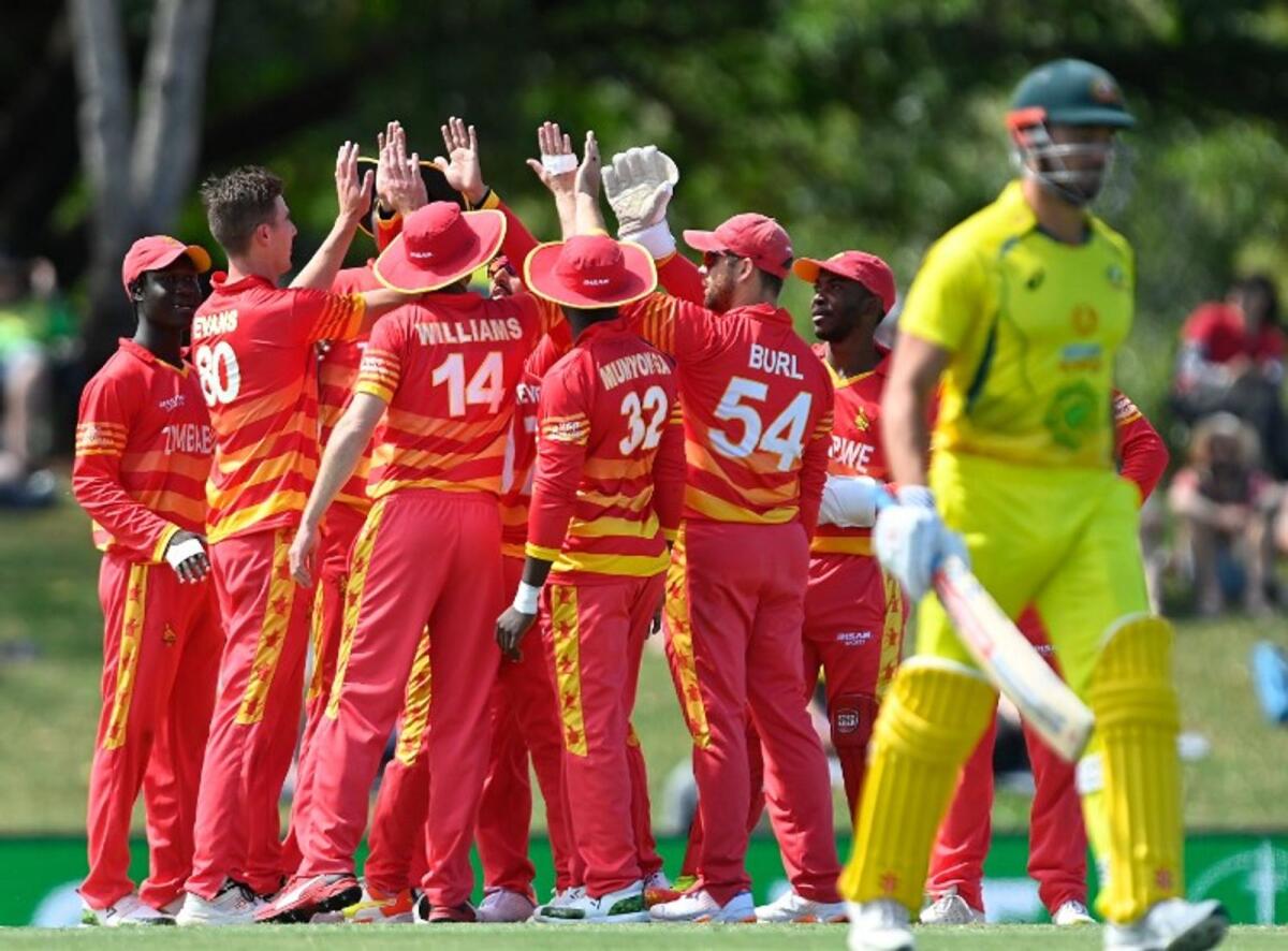 Zimbabwe players celebrate a wicket during their stunning victory over Australia on Saturday. (Zimbabwe Cricket Twitter)