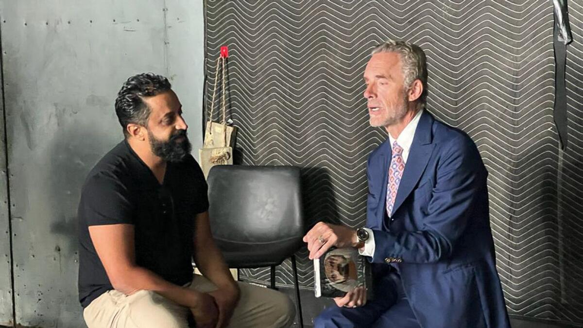Ahmed Bin Sulayem gifts Jordan Peterson a copy of  Sheikh Mohammed's book 'My Vision'.