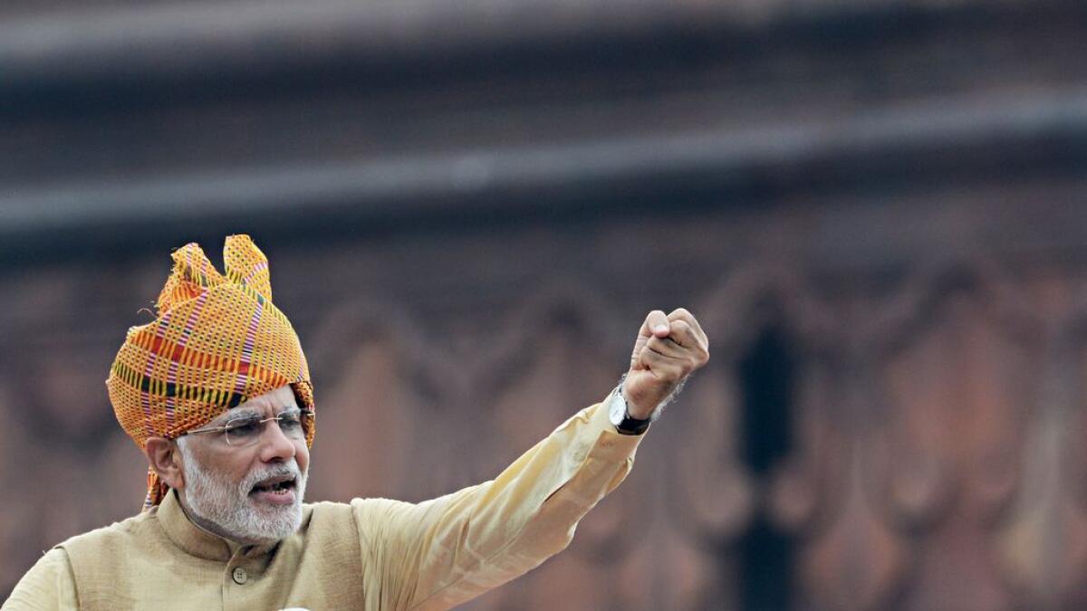 Indian Prime Minister Narendra Modi gestures as he delivers his Independence Day speech from The Red Fort in New Delhi on August 15, 2015. 