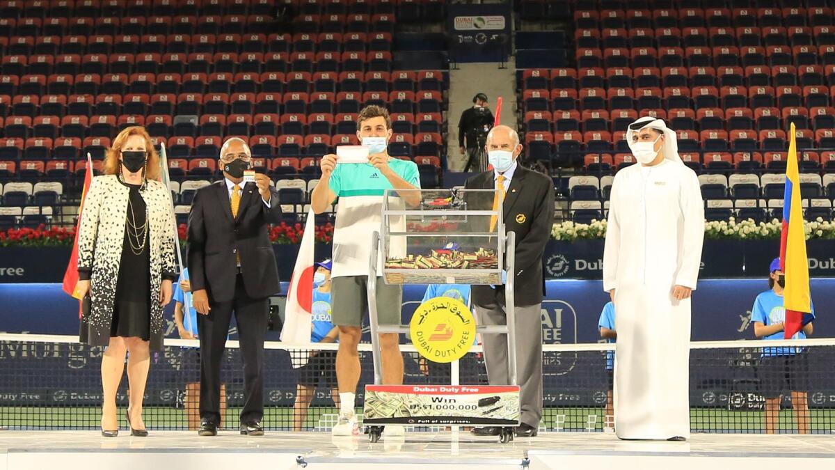 Russian tennis player Aslan Karatsev picks up the winning ticket for the Dubai Duty Free Millennium Millionaire draw. Supplied photo