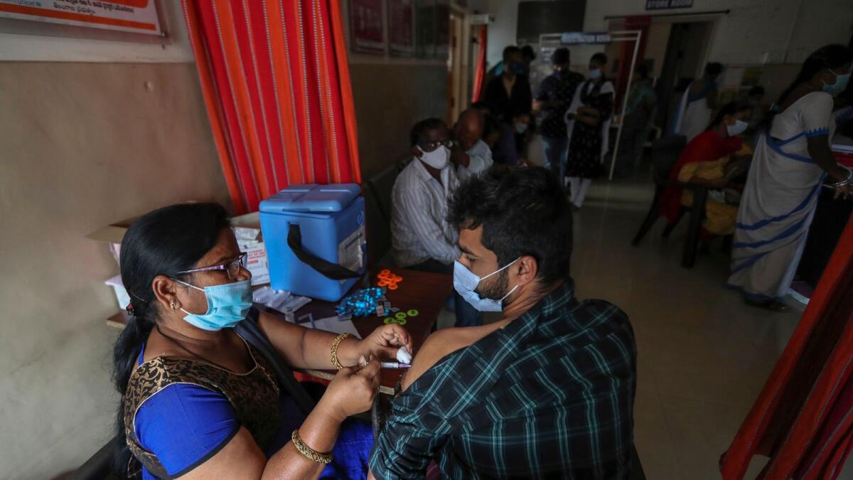A health worker administers Covaxin vaccine to a man in Hyderabad. – AP