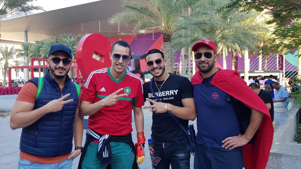 Driss (left), Mohamed (second left) and Morad (right) with an Algerian fan. Photo: Rituraj Borkakoty