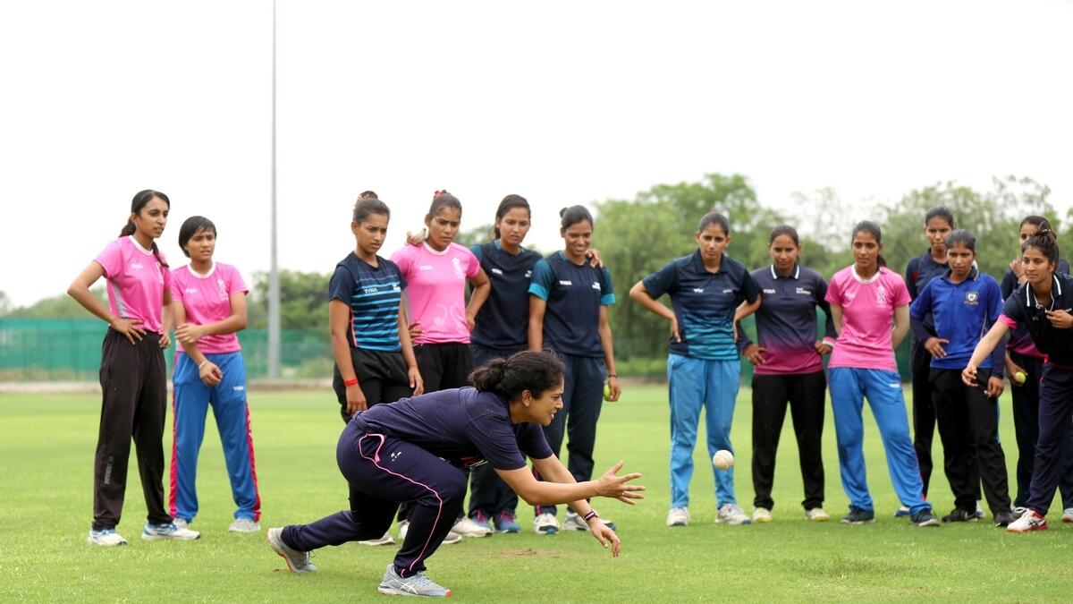 Former Australian women's team captain Lisa Sthalekar takes a catch during a training session with students of the Rajasthan Royals Academy in India. (Supplied photo)