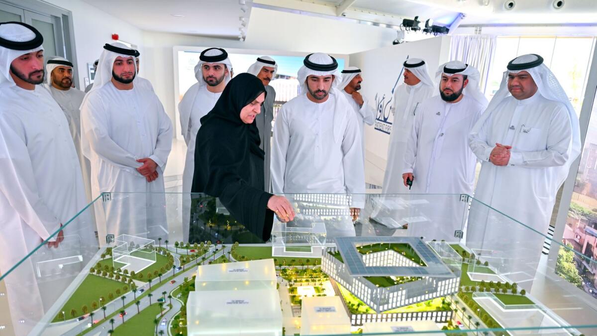Sheikh Hamdan inspects the design of the Hamdan Bin Rashid Cancer Hospital in Al Jaddaf as Sheikh Mansoor and other officials look on. — Photo: Dubai Media Office