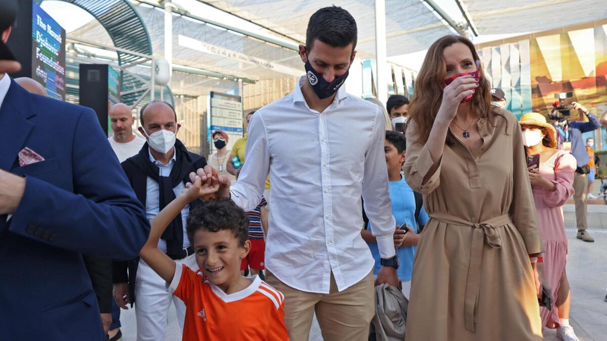 Novak Djokovic (centre) and his wife Jelena Djokovic (right) visit the Serbian pavilion at the Expo 2020 in Dubai. (AFP)