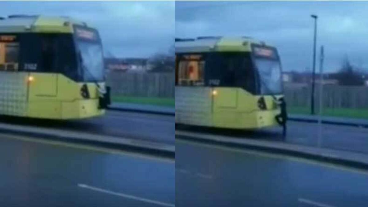 Man clings to windshield wiper for free tram ride