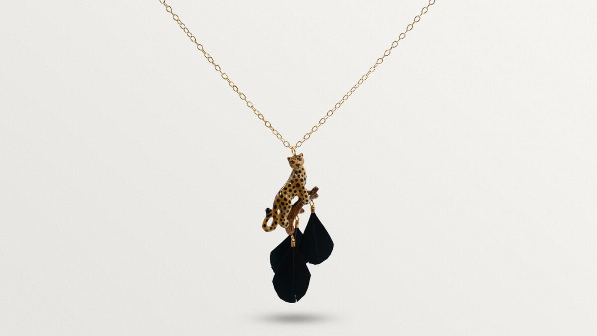 Inspired by Thai flora and fauna, this Leopard on Branch with Feathers Necklace from Nach Bijoux's creations is a statement piece. Dh800