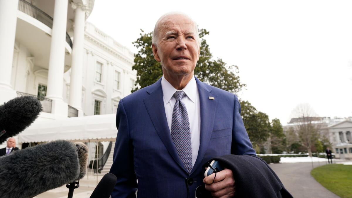 Joe Biden speaks to the media before boarding Marine One on the South Lawn of the White House. — AP