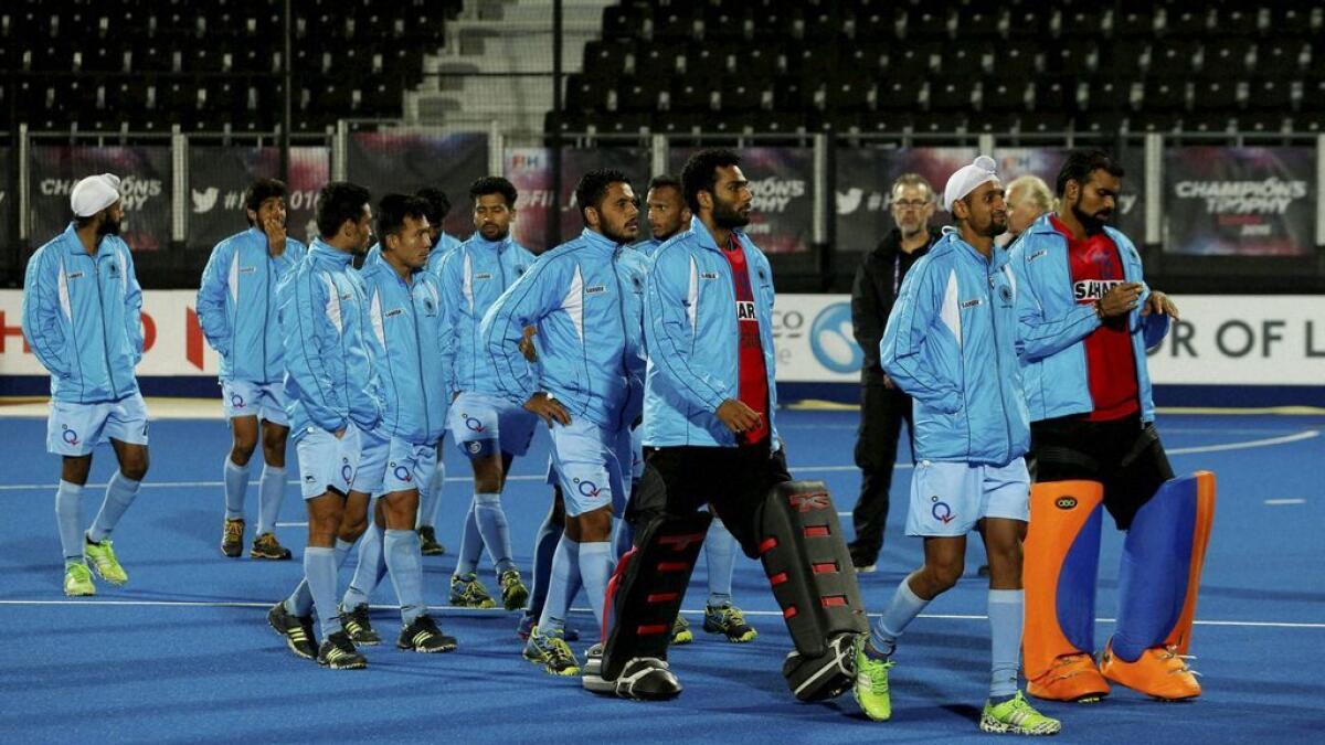 The India team walk round the pitch after lodging a protest concerning the penalty shoot the title match against Australia in the FIH Men's Champions Trophy at the Queen Elizabeth Olympic Park, London.