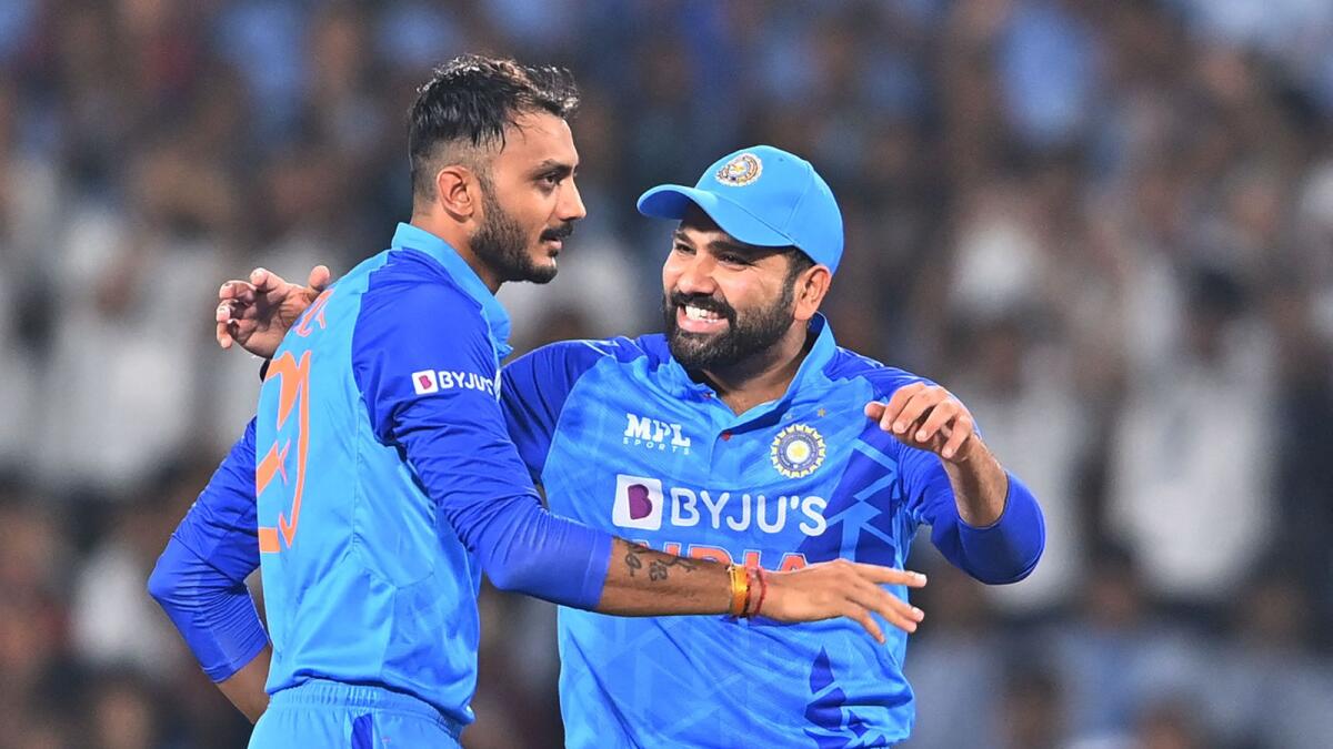 India's Axar Patel (left) with captain Rohit Sharma. — AFP