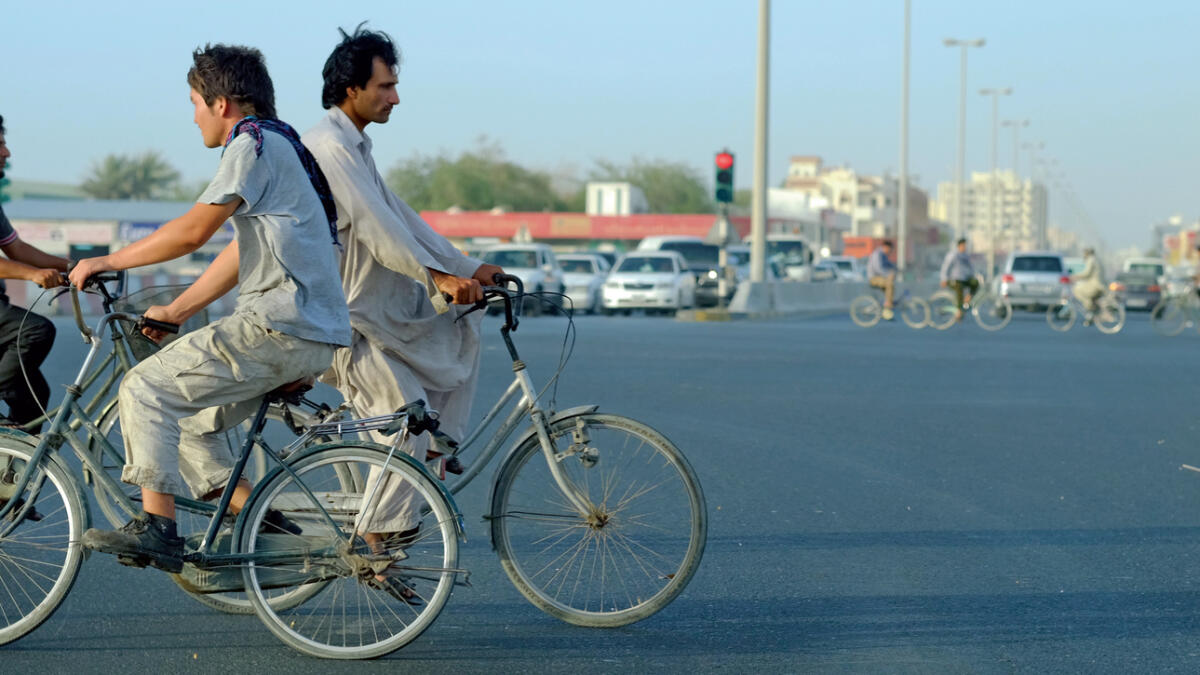 Cyclists at a traffic signal in Dubai. Photo by Shihab/Khaleej Times