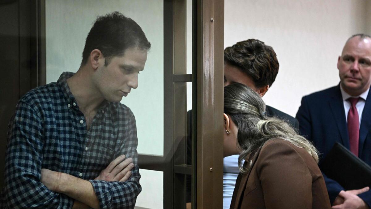 US journalist Evan Gershkovich, arrested on espionage charges, is seen inside a defendants' cage before a hearing to consider an appeal on his arrest at the Moscow City Court on Tuesday. — AFP