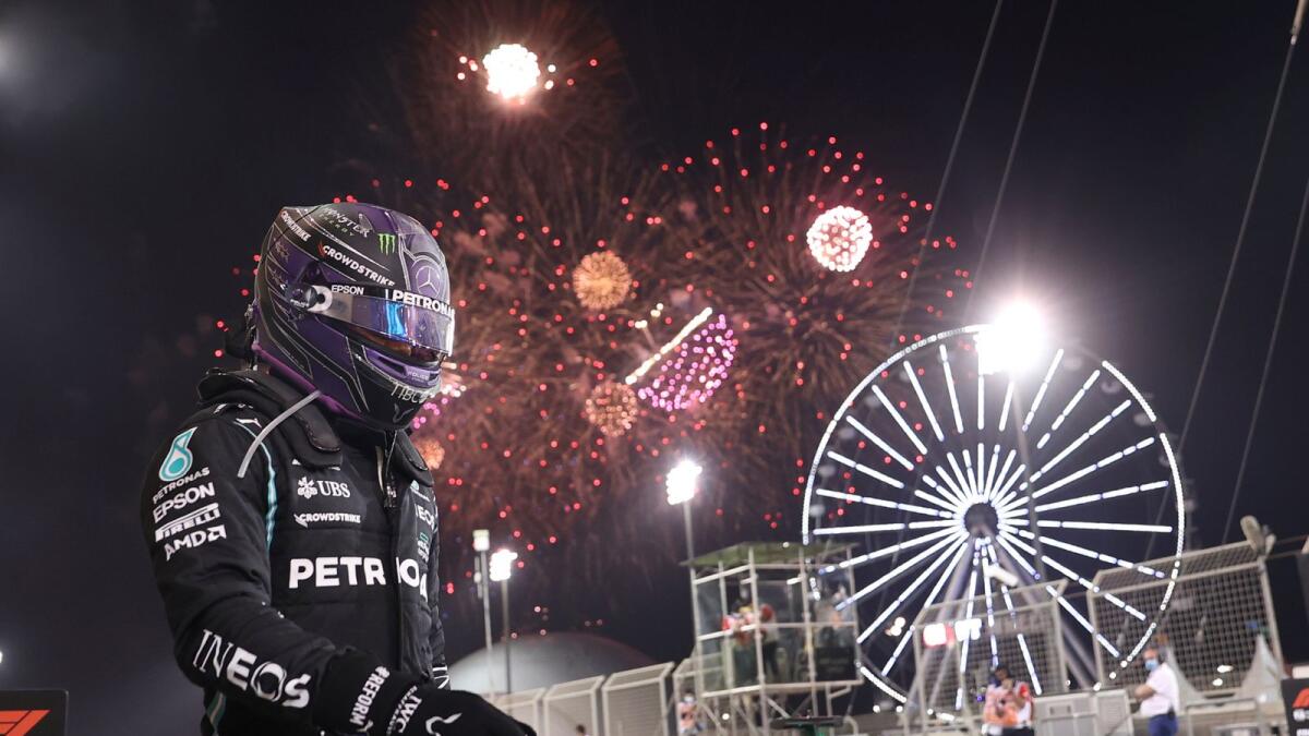 Mercedes driver Lewis Hamilton of Britain celebrates winning the Bahrain Formula One Grand Prix. — AP