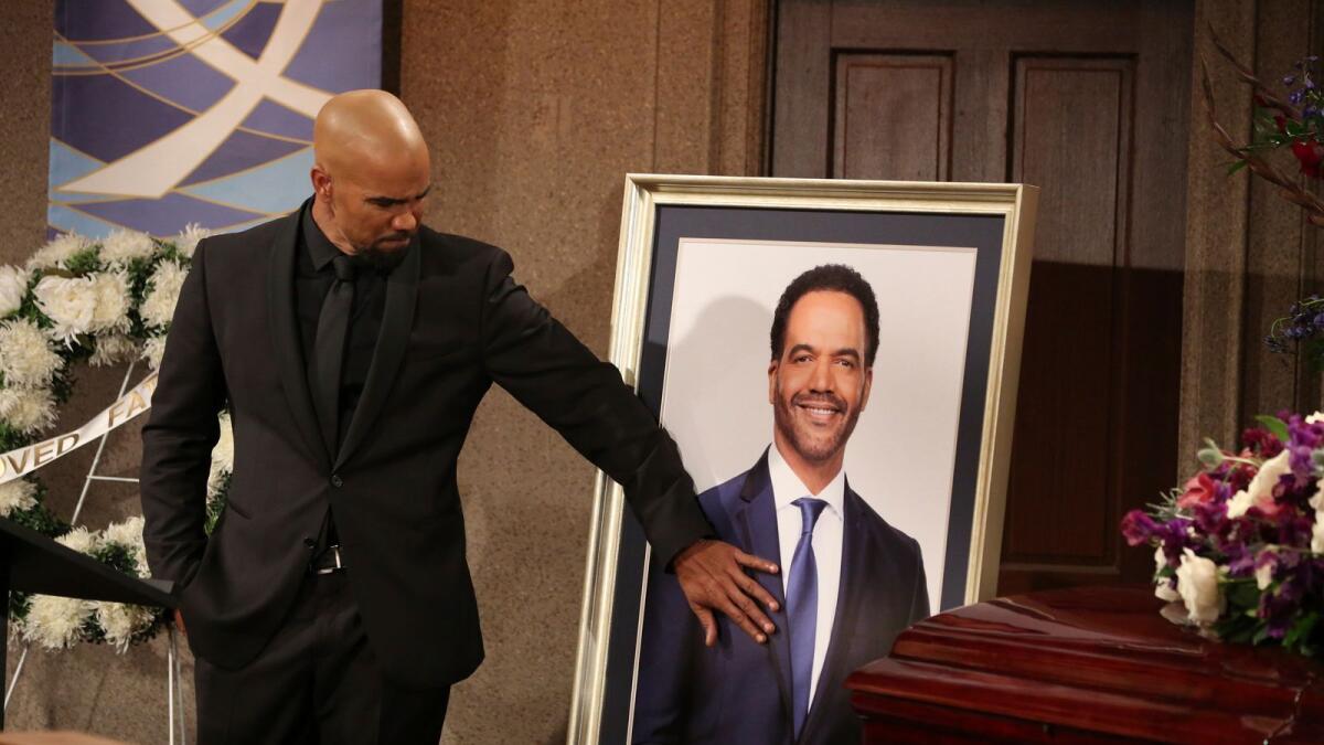 In this scene from 'The Young and the Restless,' Shemar Moore, who portrays Malcolm Winters, appears at the funeral for his brother Neil, played by the late Kristoff St. John, who died in 2019