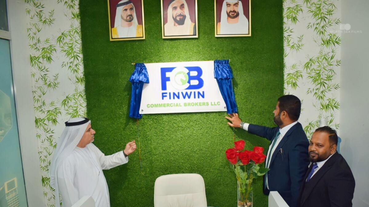 Mohamed Ali Balushi, regional manager at ADCB; Rusan Fyroze, CEO at Siraj Finance, and Faroon Hamim, chairman at Finwin Group, unveiled the Finwin Commercial Brokers logo at their head office.