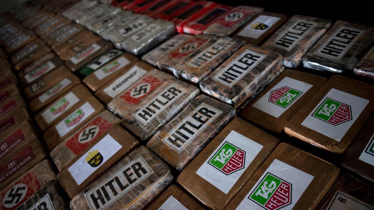 Packages of cocaine totalising 9,436 kilos, that were found hidden in a container from Ecuador, are seen during a police press conference at the port of Algeciras, southern Spain. — AFP