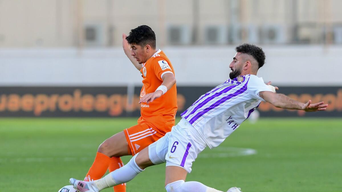 Al Ain’s Yahia Nader (right) vies for the ball with Ajman’s Isam Shaitit during the Arabian Gulf League match at the Rashid bin Saeed Stadium on Sunday. Al Ain won the match 2-0. —  Al Ain Twitter