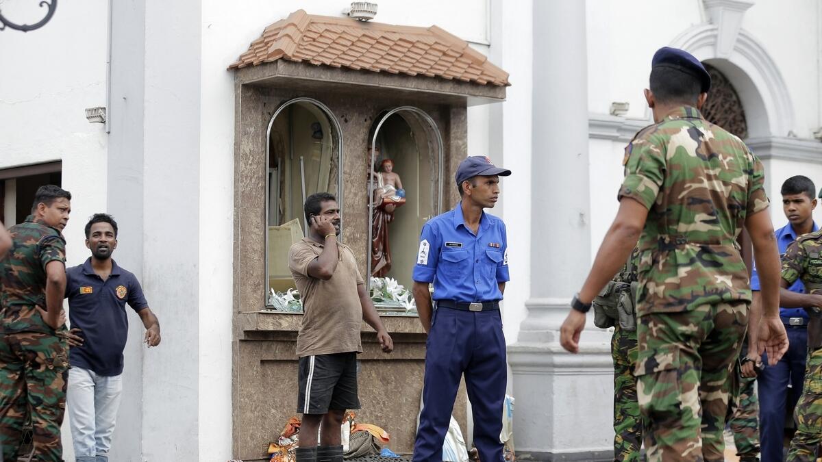 People gather outside St. Anthonys Shrine where a blast happened, in Colombo, Sri Lanka, Sunday, April 21, 2019.- AP