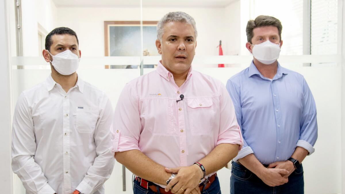 President Ivan Duque speaks, flanked by Interior Minster Daniel Palacios, left, and Defense Minister Diego Molano, in Cucuta, Colombia on June 25, 2021. Photo: AP