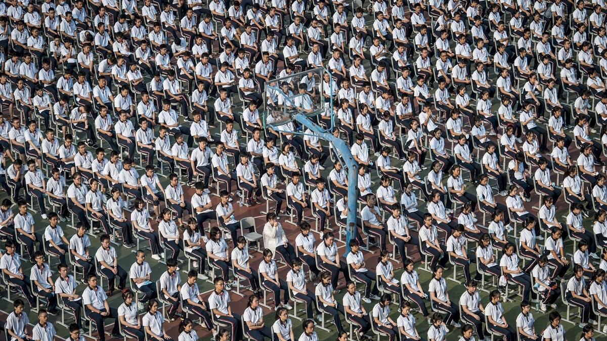 Students attend the 100th anniversary of the founding of Wuhan High School on the first day of the new semester in Wuhan in China's central Hubei province. Photo: AFP