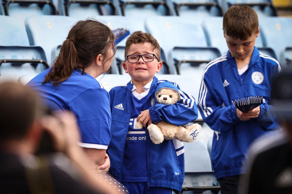 A young Leicester City cries after the team's relegation on Sunday. — AFP