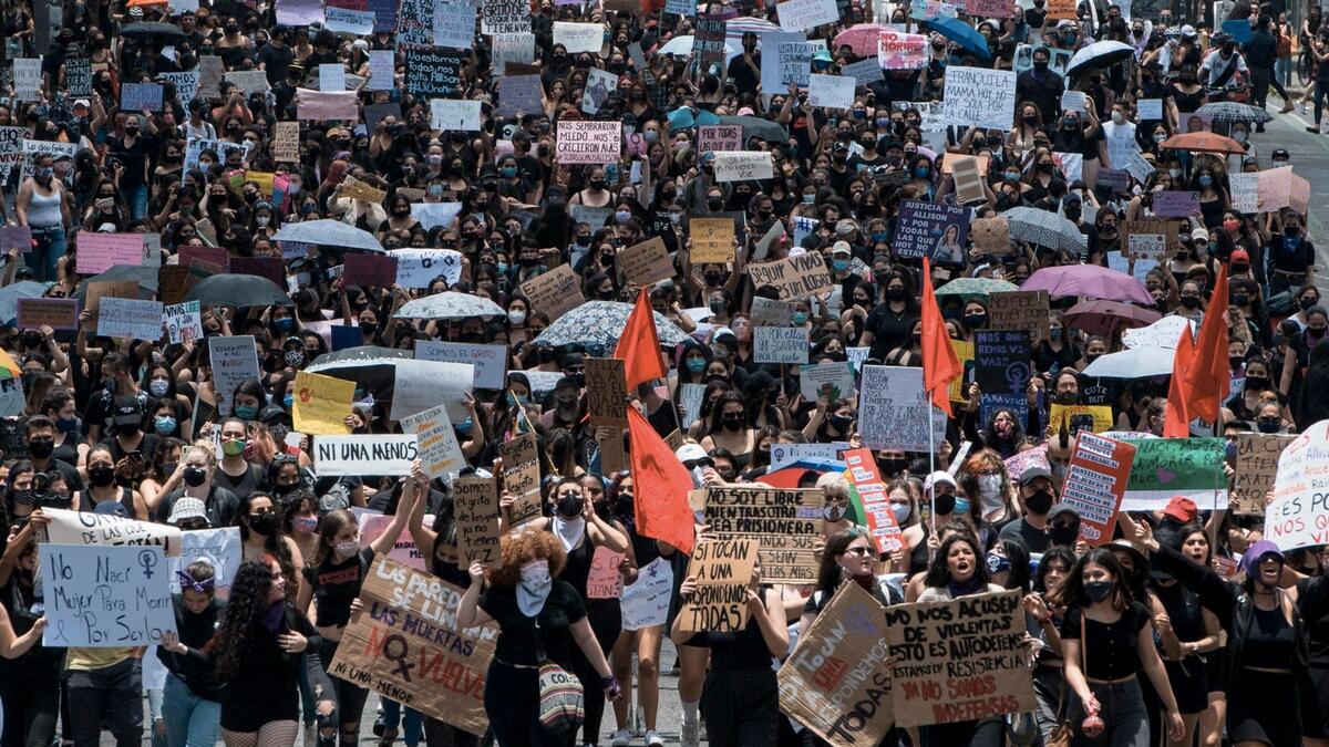 People protest against femicides during a march also called in rejection of austerity policies promoted by the government to contain public spending amid the Covid-19 novel coronavirus pandemic, in San Jose. Photo: AFP