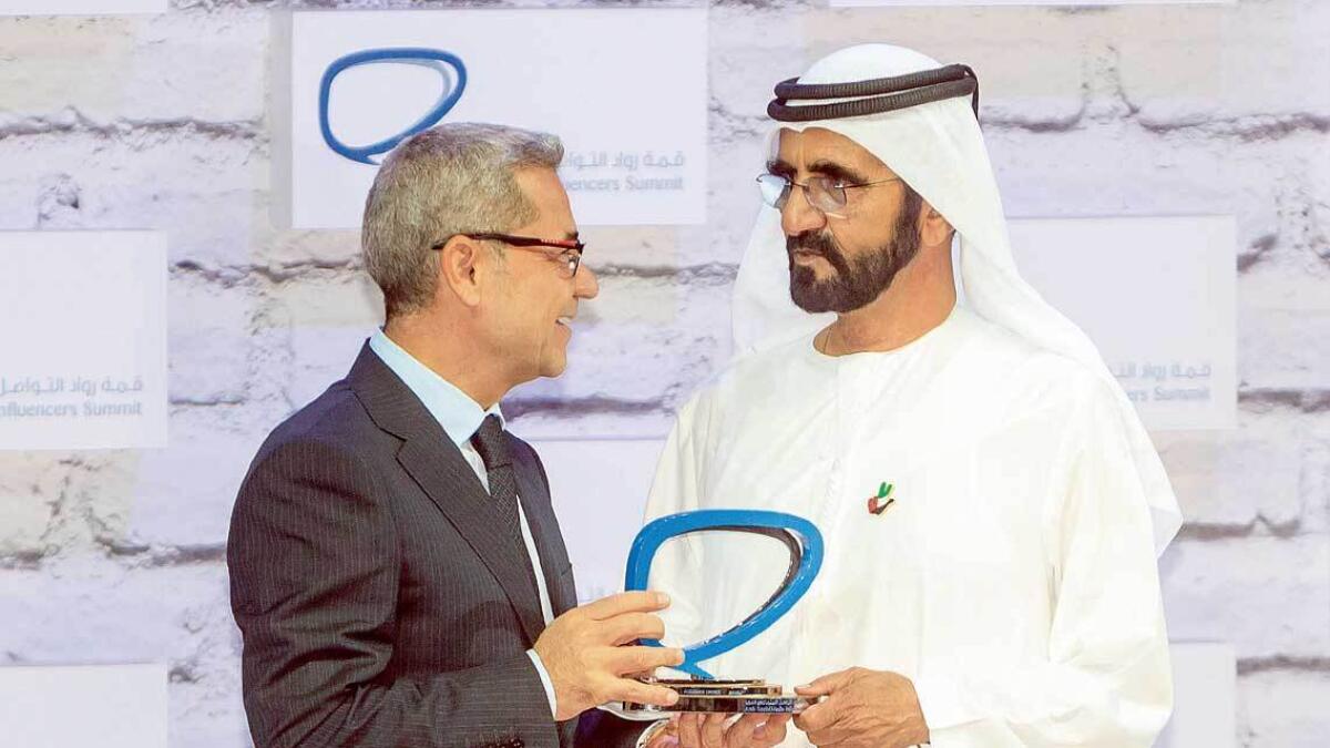 Mustafa Al Agha, head of MBC Sports, receiving the award from Shaikh Mohammed in the Audience Choice category.