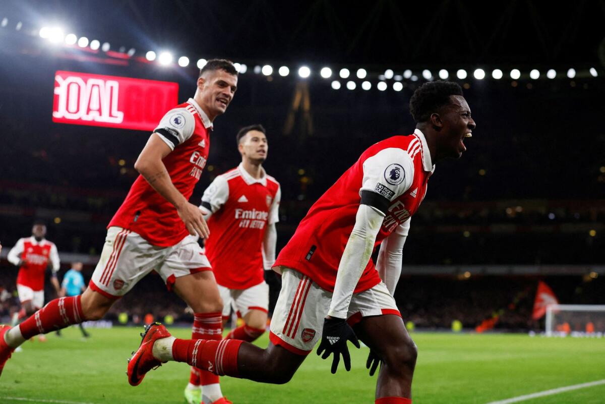 Arsenal's Eddie Nketiah celebrates scoring their third goal with teammates. -- Reuters
