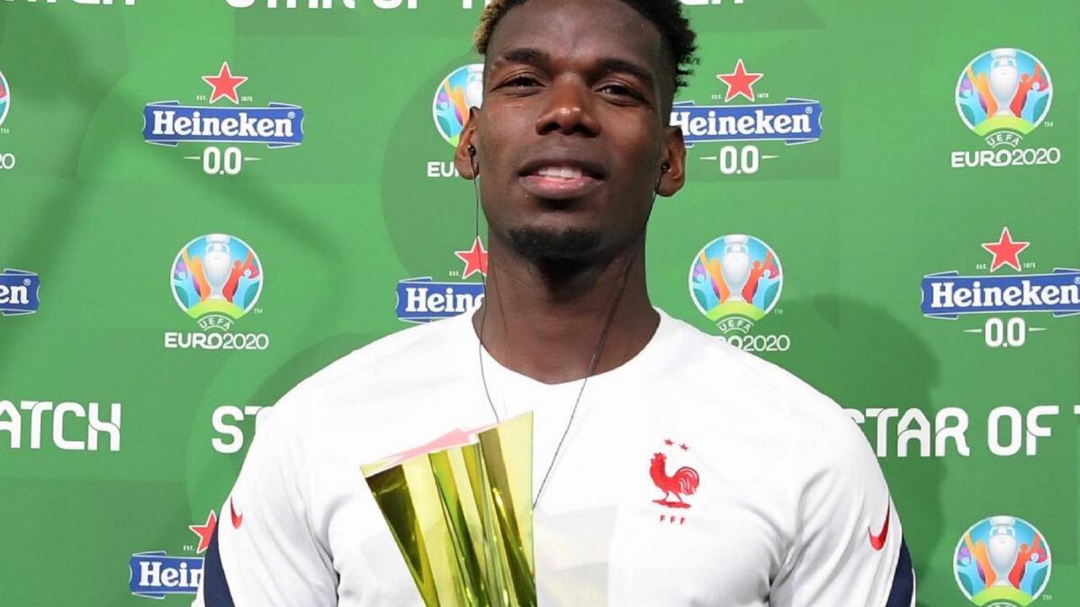 Paul Pogba with the man-of-the-match award. (Twitter)