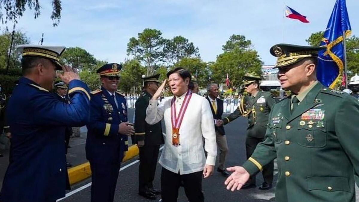 Philippine President Ferdinand Marcos Jr. is greeted during his visit at the Philippine Military Academy in Baguio city, northern Philippines, on Saturday. — AP
